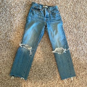Levi’s Wedgie fit with distressed knees and hem